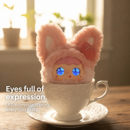 Lychee Berry pink rabbit plush with expressive LED eyes, pictured in a teacup scene.