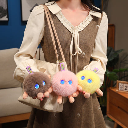 Plush companion bag charms attached to bags